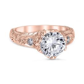 Vintage engagement ring featuring a fan of flower petals set with diamonds and fine wire filigree accents.